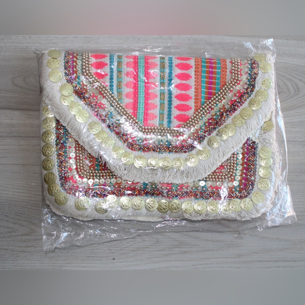 Boho Clutch/crossbody bag with Pink. It has chain in it to use it as a crossbody
